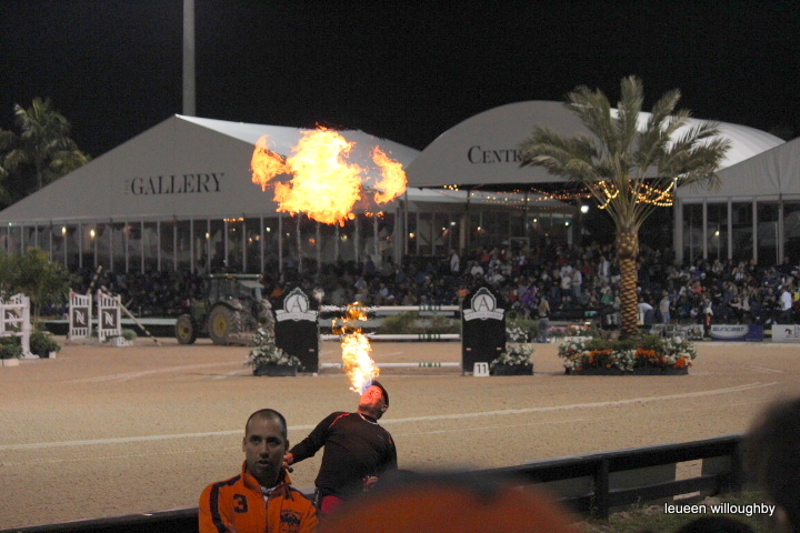 Fire eater entertains during interval.